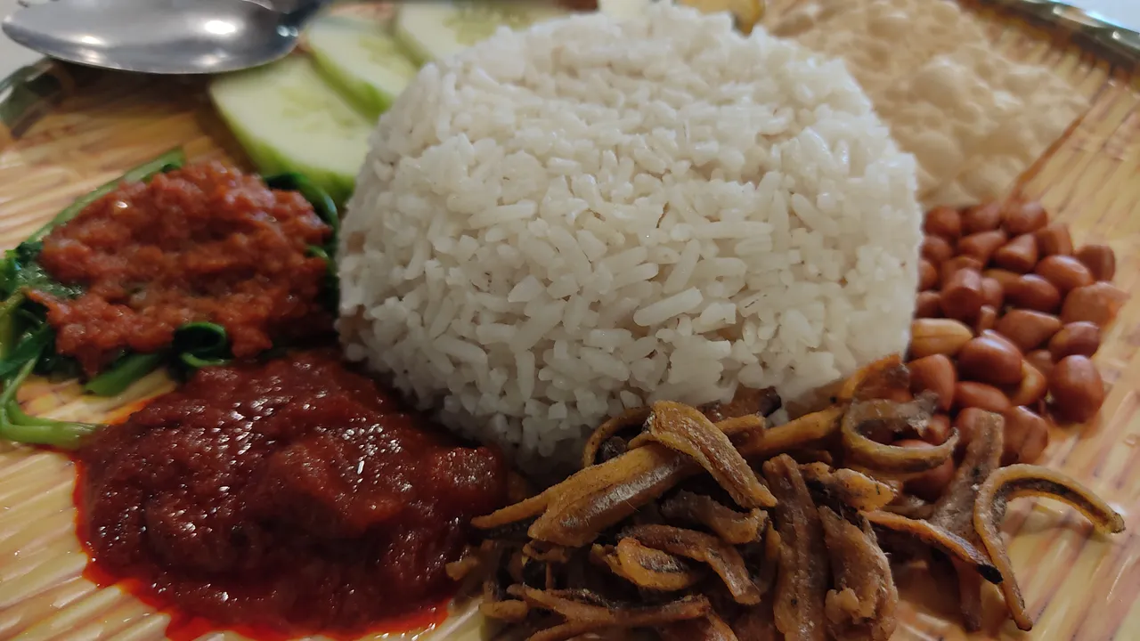 Traditional Malaysian food spread at a local outdoor dining area